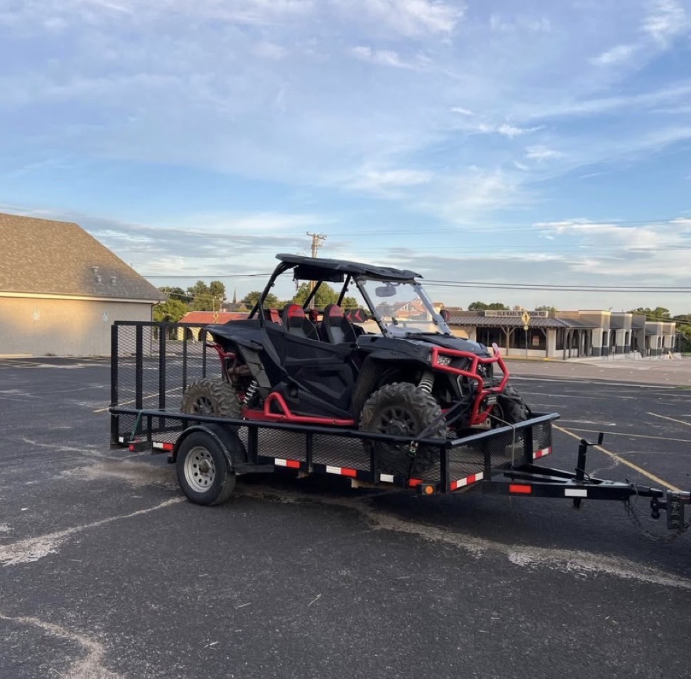 13ft utility trailer loaded with a side-by-side UTV